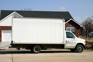 Moving van in front of a house