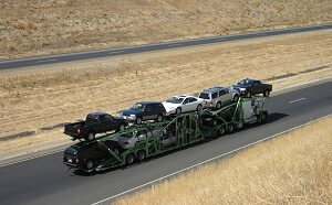 Auto transporter delivering cars
