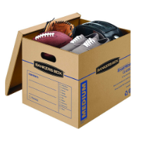A cardboard Bankers Box filled with a football, baseball glove, shoes, and a toaster