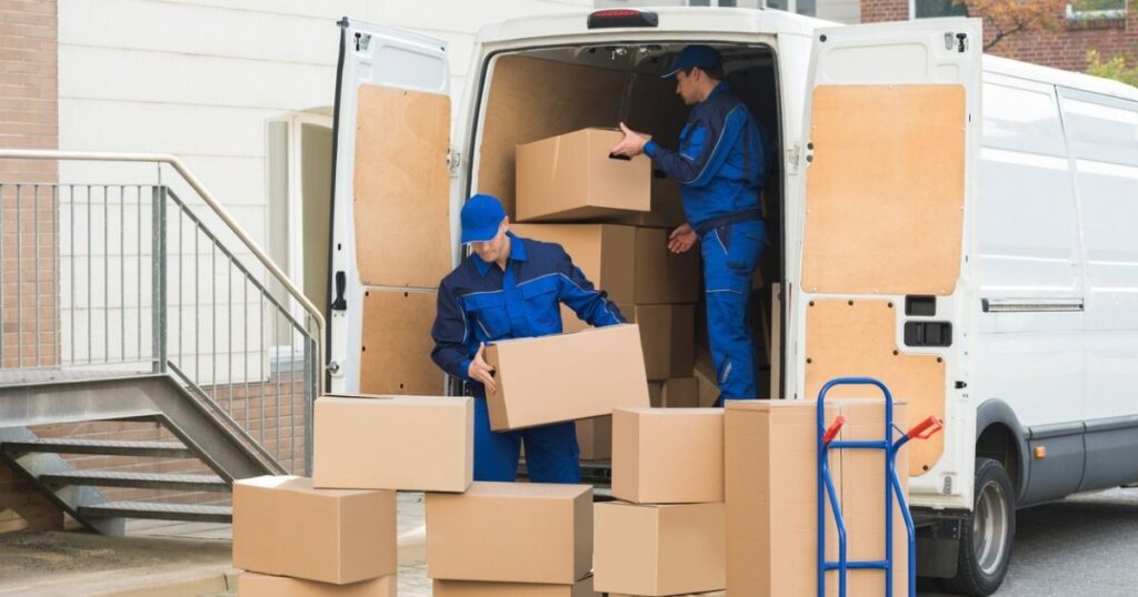 Professional movers loading a moving van