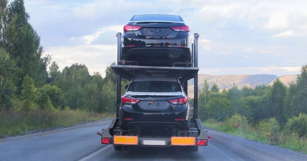 A truck transporting cars